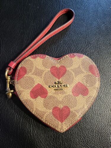 coach purse with pink hearts